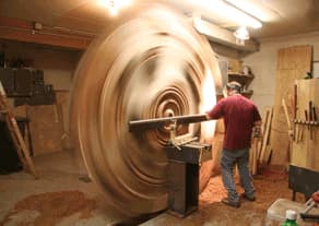 Dave Barkby turning a burl wood wall sculpture on his lathe